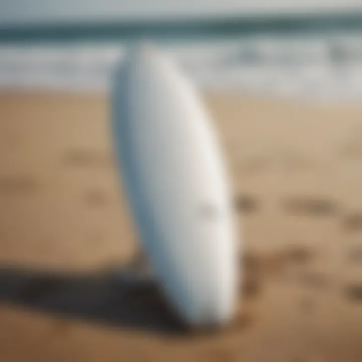 A foil surfboard next to traditional surfboards for comparison