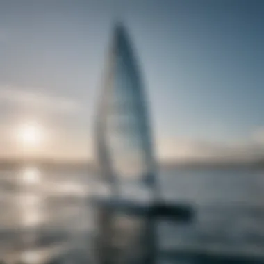 A foiling sailboard gliding over the water surface, showcasing its aerodynamic design.