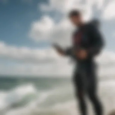 A kiteboarder analyzing weather data on a smartphone before heading out.