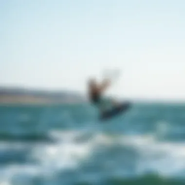 Kiteboarder utilizing a universal wing on the water