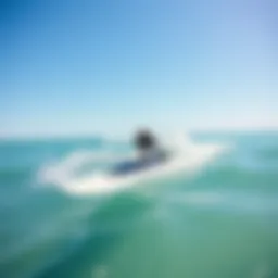 A sleek water foil surfboard gliding over the surface of the ocean