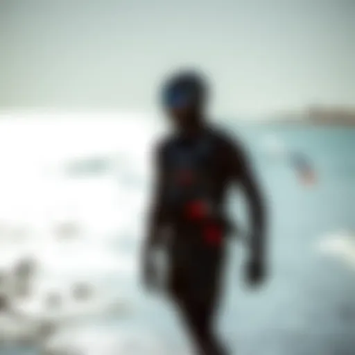 Kiteboarder in a modern wet suit by the shore