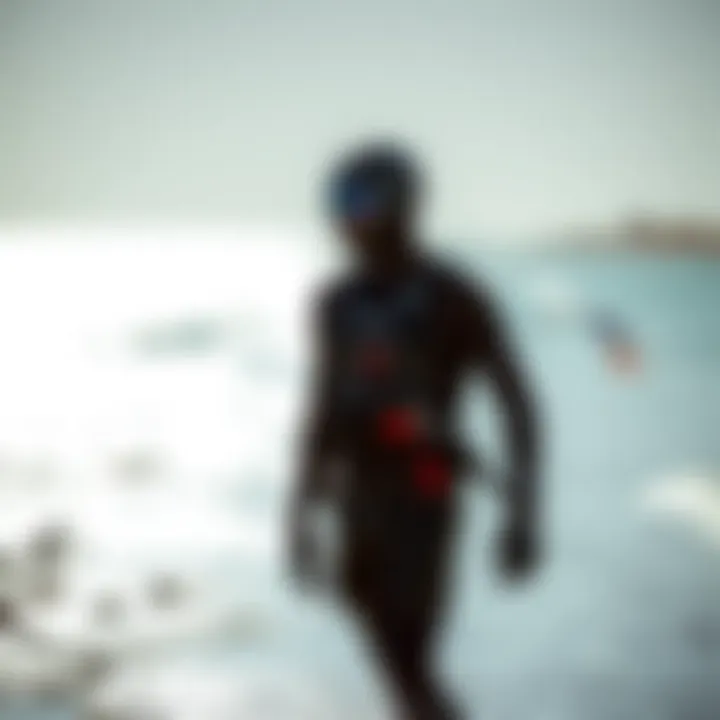 Kiteboarder in a modern wet suit by the shore